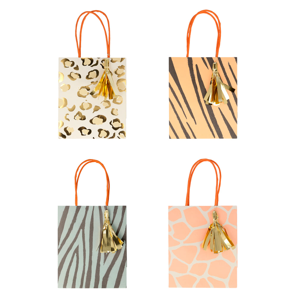 Paper party and treat bags in four prints, cheetah, tiger, zebra and giraffe prints, each with a gold Mylar tassel, braided handle.