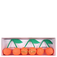 boxed set of three crepe paper cherry surprise balls.