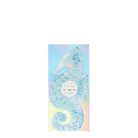 Seahorse shaped napkins in aqua with blue foil details, sixteen napkins per package