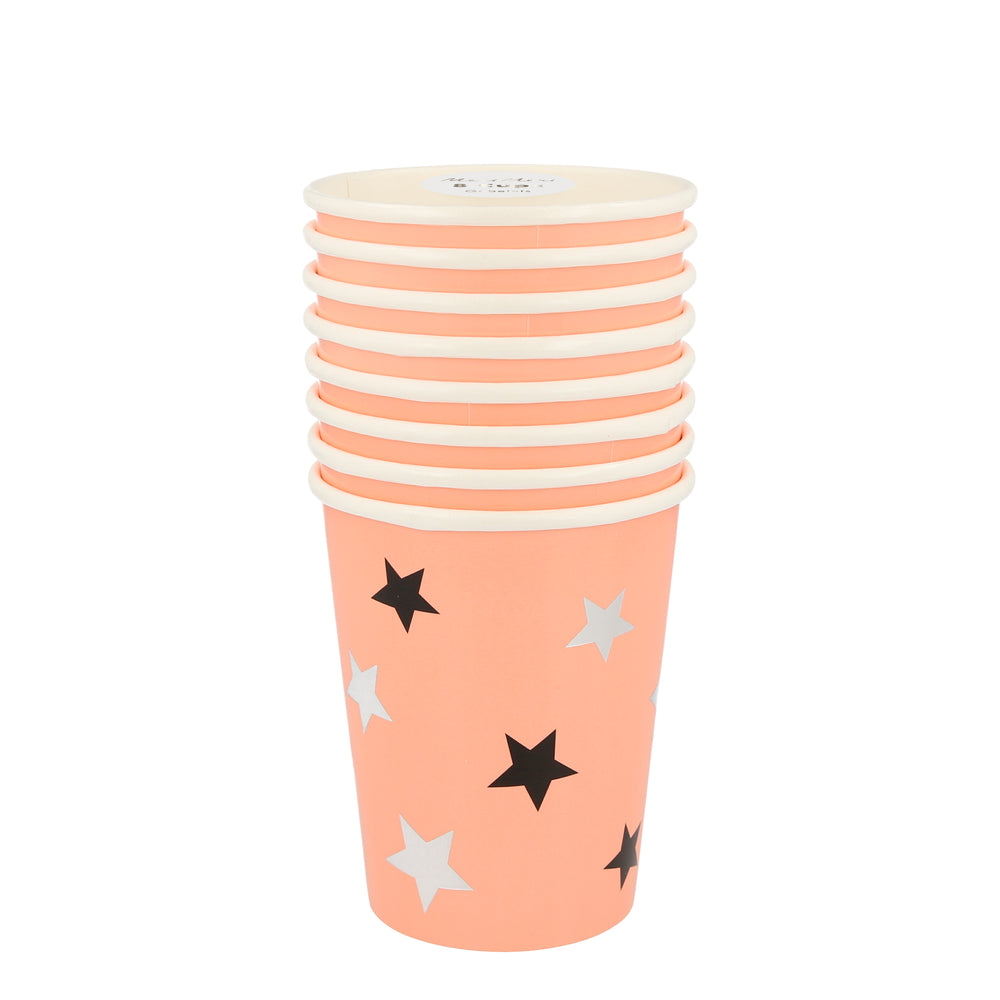 Pack of eight Halloween themed party cups. Soft orange with black and shiny silver foil stars. Eight ounces and for use with hot and cold beverages