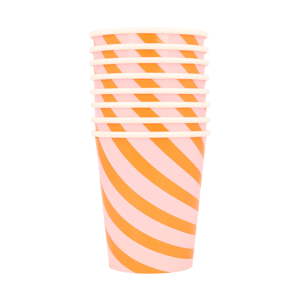 Set of eight stripy cups. Pink and orange print in a diagonal. 