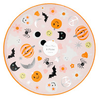 Pack of eight paper party plates, round soft pink with bright orange rim and cool Halloween icons including cat, bat, moon, happy face, spiders, mushrooms, ghost, flower power flowers.