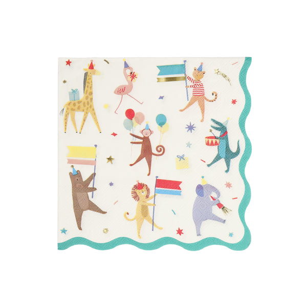A square paper party napkin with scalloped edges, featuring a whimsical animal parade print on a white background. The design includes a alligator, giraffe, flamingo, monkey, bear, lion, and elephant holding flags and balloons, surrounded by confetti and gold foil stars. Green Border