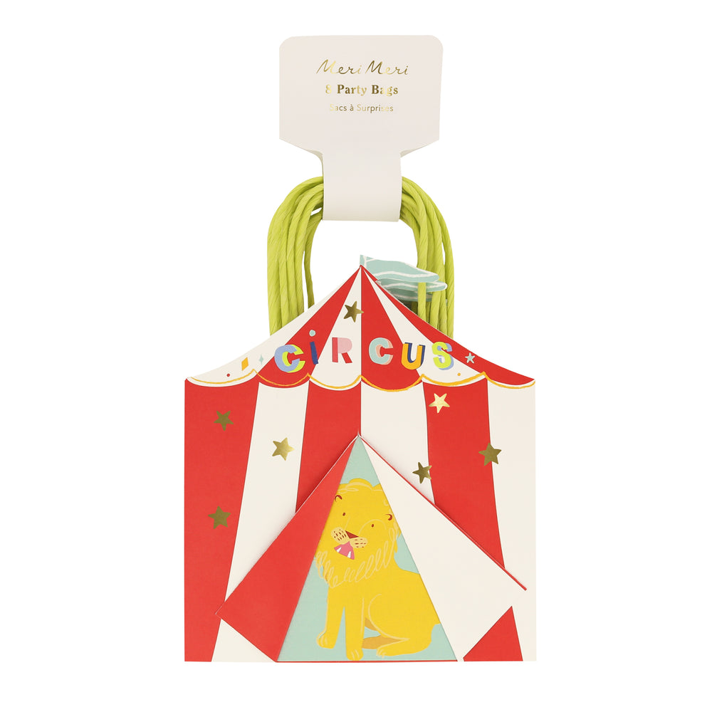 Circus-themed paper party favor bags. Package of eight bags, bold red and white circus shaped bags with a colorful crowned sign, flag at top, shiny gold foil stars and a lion featured at center.
