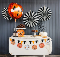 Pumpkin shaped orange Mylar balloon with Halloween decor