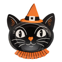 Vintage inspired smiling black cat with big white eyes, orange heart shaped nose wearing an orange witch hat with a black band and buckle.