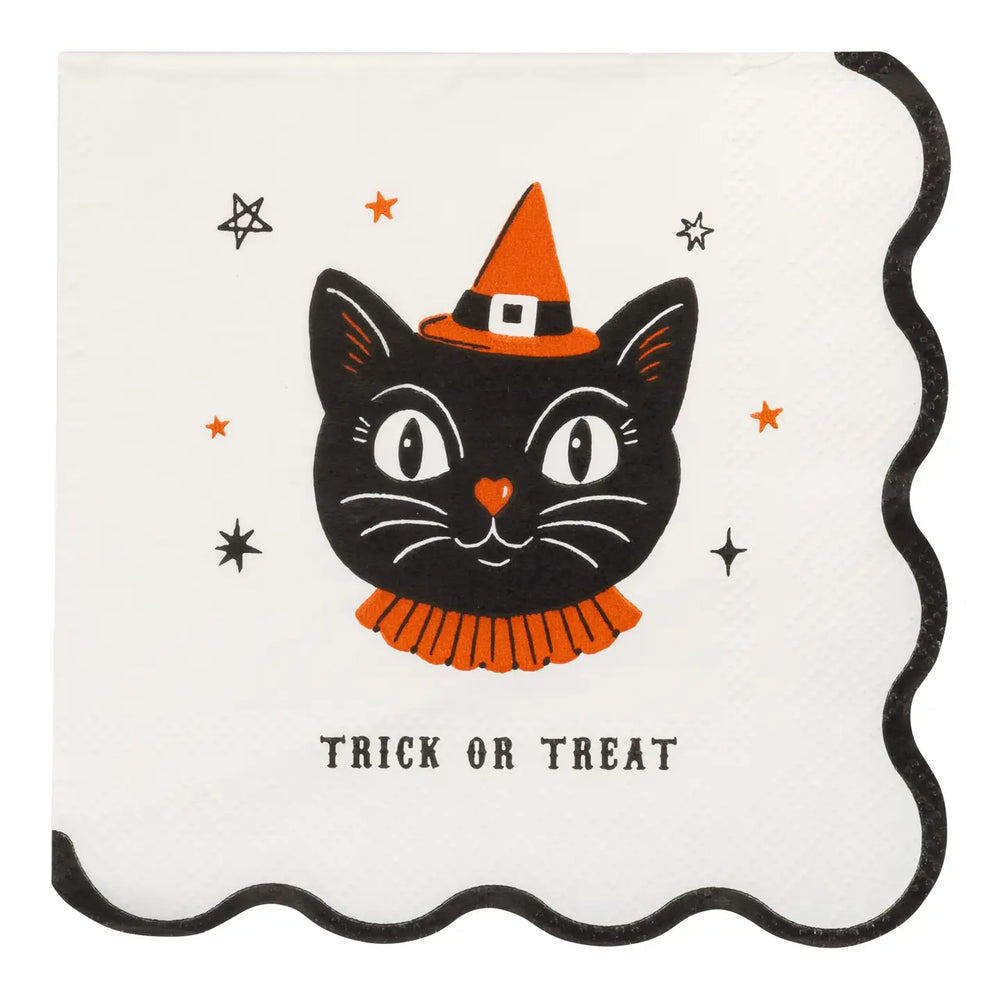 A square cream color paper napkin with a scalloped black border, featuring a vintage inspired black cat wearing an orange witch hat and orange ruffled collar, with small orange and black stars and the words 'TRICK OR TREAT' printed below.