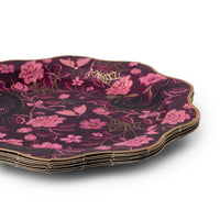 Set of eight decorative paper plates with pink floral design, ravens, moths and gold metallic highlights and border.