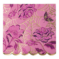 A square pink and purple floral print paper napkin with a scalloped gold edge, featuring a metallic gold foil pattern of spiderwebs, roses, and a butterfly on a pink background.