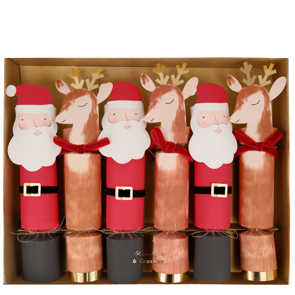 These Christmas crackers feature a happy Santa and a sweetly smiling reindeer. The crackers have gold foil details, velvet ribbons, and each contains a small gift, a hat and a joke. Suitable for ages 8+ Pack of 6 in 2 designs Product dimensions: 3 by 11.5 by 2.5 inches..
