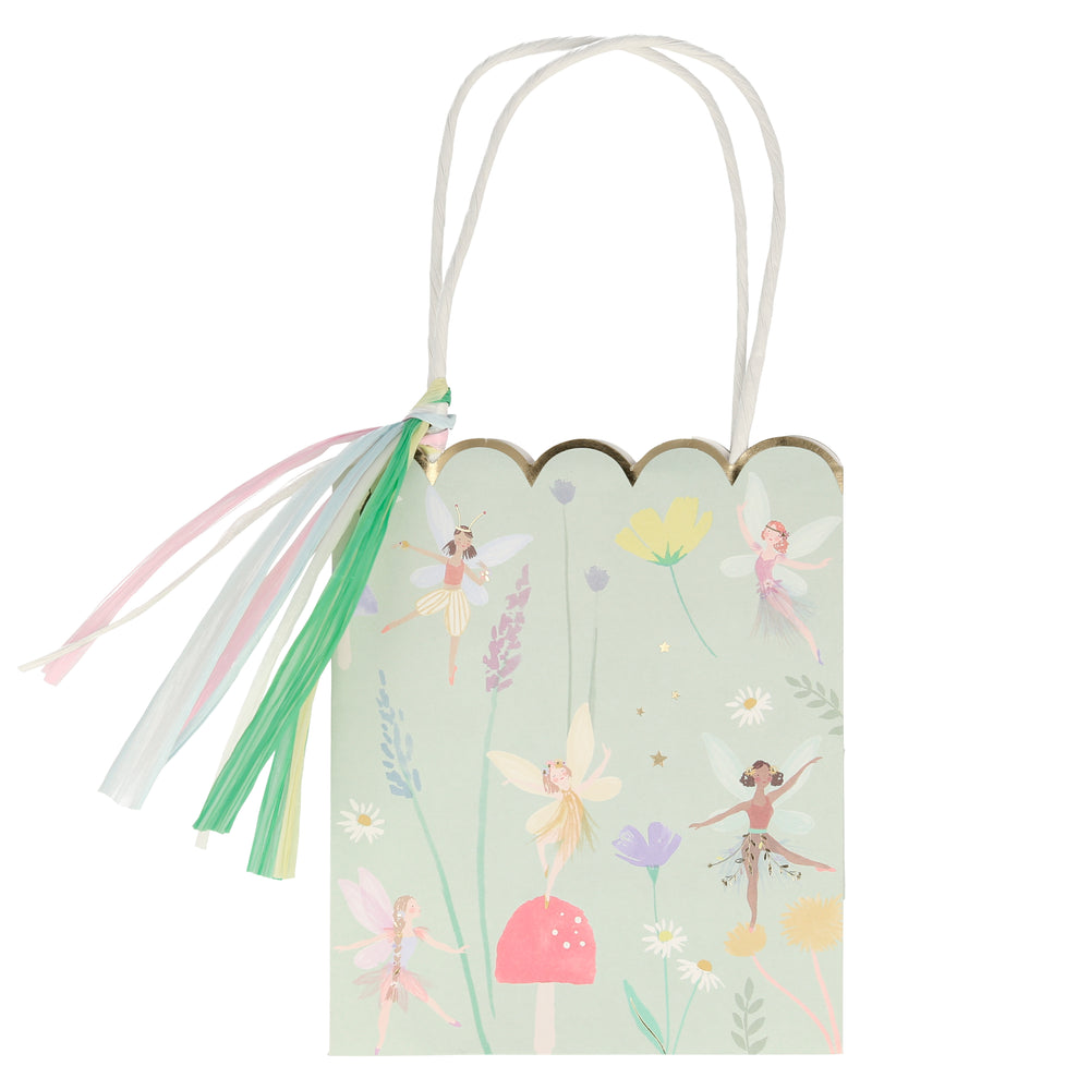 flying fairy print on paper party bags illustration print includes beautiful and whimsical fairies, toadstool, butterfly and flowers on a soft mint green back-round color  set of eight bags perfect for gifts and favors, five inches wide , six inches tall and three inches deep in a set of eight pieces 