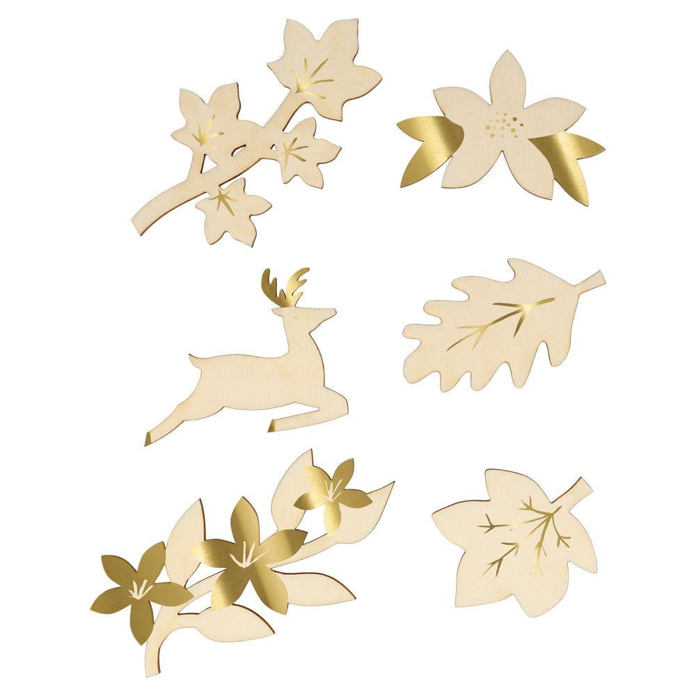 These fancy crackers are floral and festive. Each cracker contains a joke, gold paper hat and a wooden brooch with gold foil detail. These are a sample of some of the brooches, which are flowers, foliage, and wildlife designs.