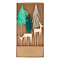 Turn any cake into a woodland delight with these beautiful toppers. Three trees in three colors, light green, dark green, and brown, crafted from crepe paper, and two deer made from etched wood. They are perfect for bringing nature to any party. The toppers are placed on bamboo skewers, for easy insertion into your baked goods. Pack dimensions: 5.5 by 11.125 x 0.5 inches.