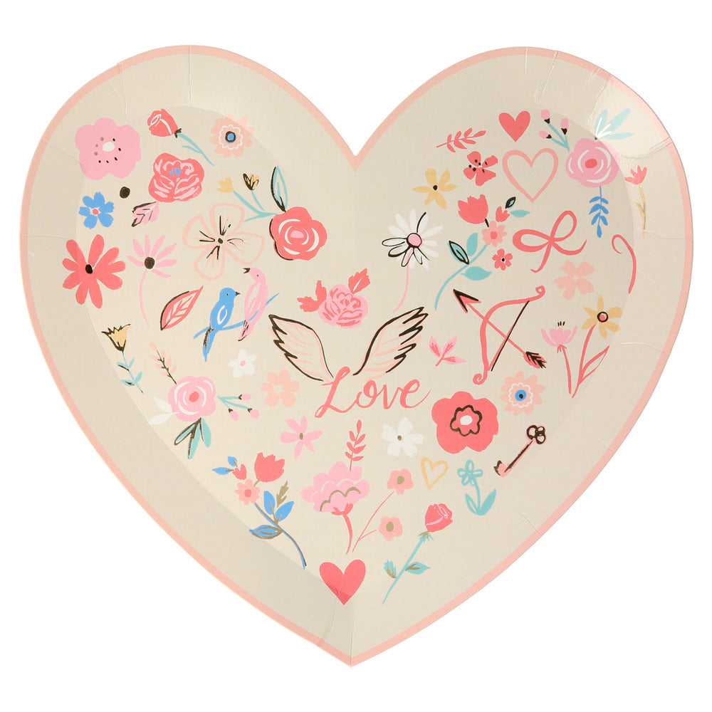 Heart shaped plates with a soft pink border and floral print featuring two lovebirds, bow & arrow, the word love with wings on the letter L, illustrations in beautiful shades of coral, blue, pink, teak and yellow on creme 