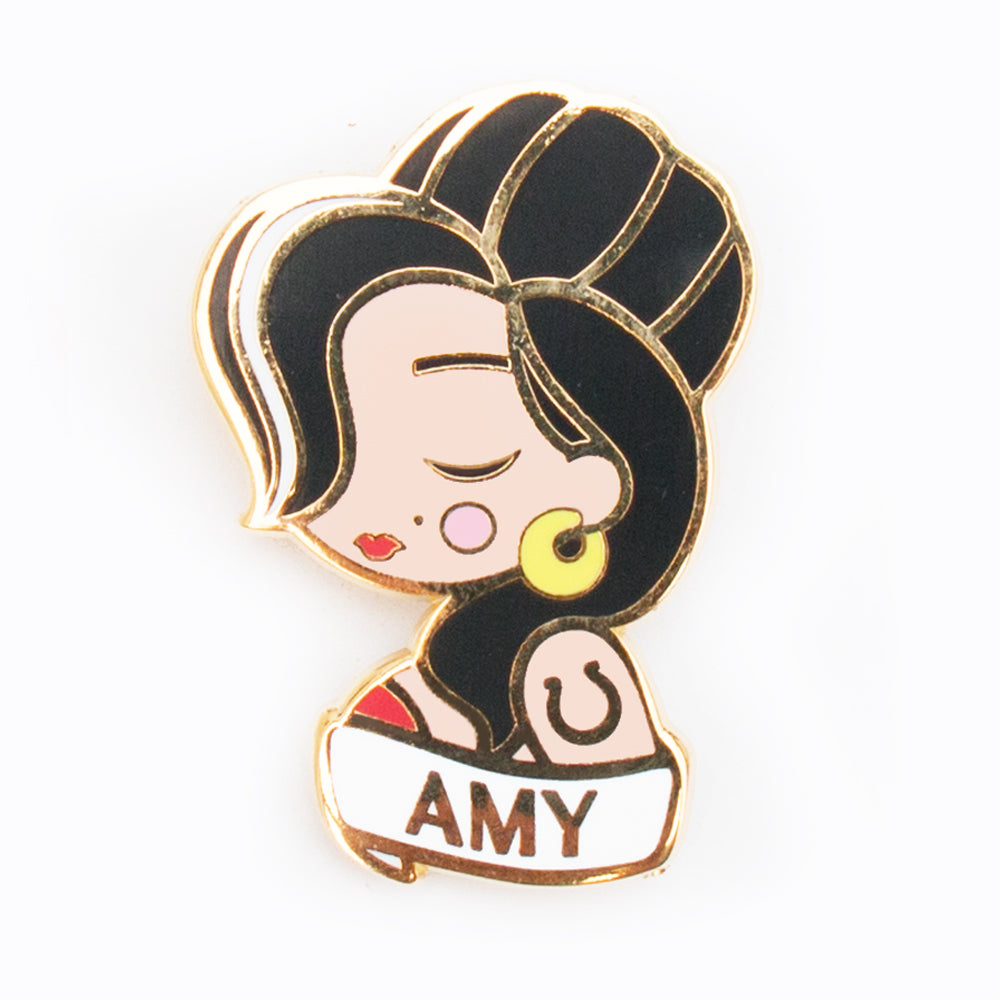 singer song-writer amy winehouse character enamel pin made of gold metal colored enamel with a pin attachment