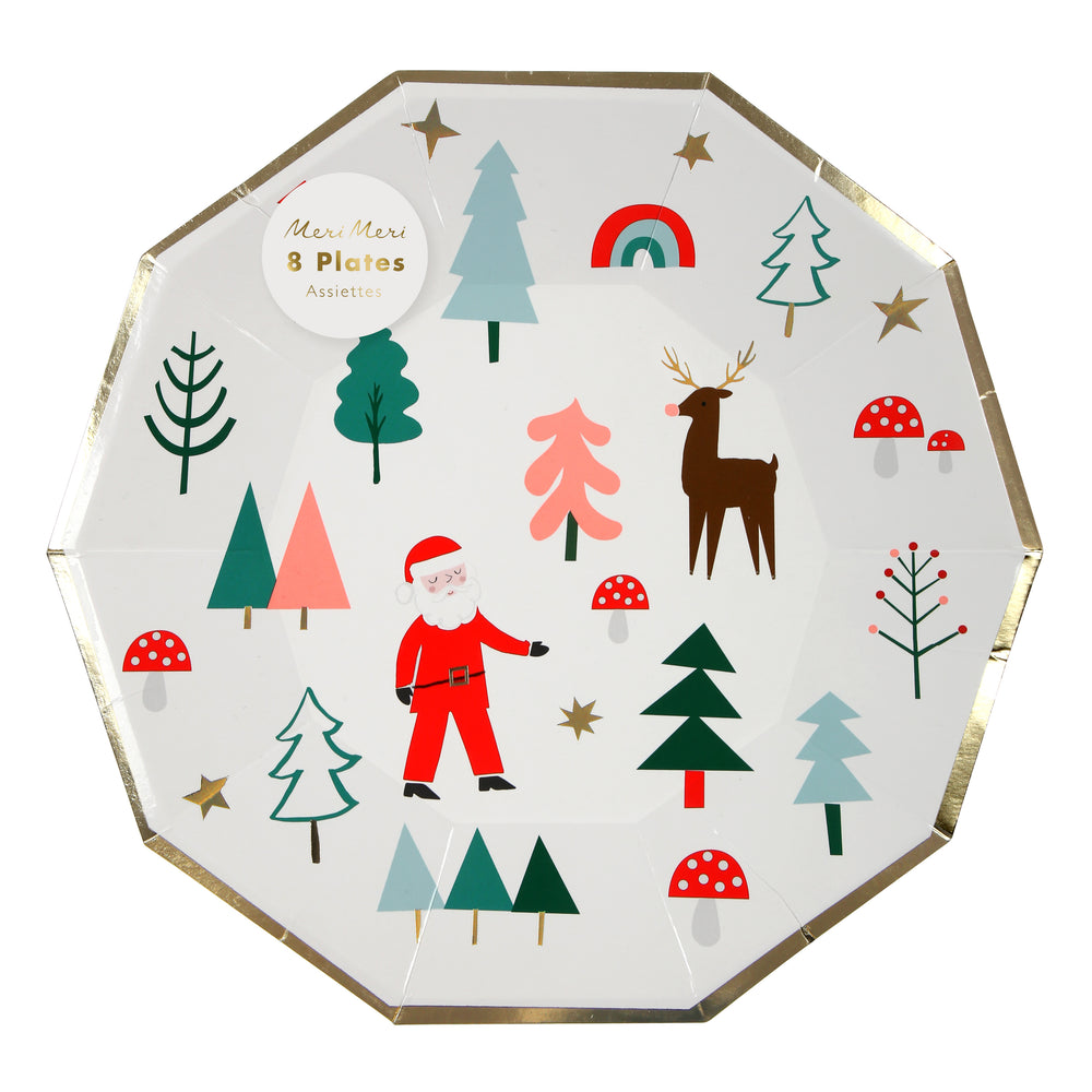 Holiday paper party plates, white with a whimsical print of holiday icons including Santa, a reindeer, pine trees, a rainbow, red and white mushrooms and embellished with gold foil stars and border of plates, set of 8 