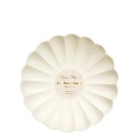 cream eco plates are made from all natural materials - pulp from bamboo, wood fiber and sugarcane and colored using water-based ink dyes. They are molded into an elegant curved shape, with a scalloped edge. Package of eight plates