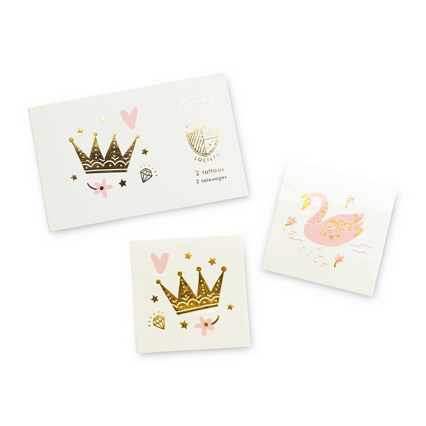 Sweet Princess temporary tattoos by Daydream Society featuring a gold crown, diamond, heart, stars and a pink swan.