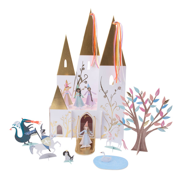 Beautiful princess party castle centerpiece. Featuring a beautifully illustrated princess castle with shiny gold turrets and colorful ribbons four princess's unicorn pond with a swan, tree, knight on horse and a fire spewing dragon and the princess's pet dog adorned with a crown