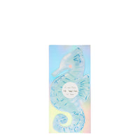 Seahorse shaped napkins in aqua with blue foil details, sixteen napkins per package