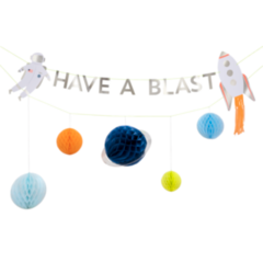 Space themed party garland includes two rows of decorative garland, row one includes one astronaut , one rocket and the words " have a blast " in shiny silver  cardstock,  second row includes five honeycomb planets, orange, yellow, light blue, aqua blue and dark blue Saturn with a silver ring