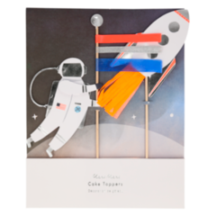 astronaut with flag pole made of coral, neon orange orange and royal blue ribbons and rocket with orange crepe paper flames. set of two toppers.